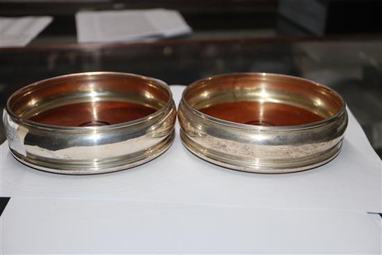 Two pairs of modern silver wine coasters, largest 13.2cm.